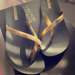 Ipanema Gold and black flip flops